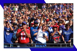 Buffalo Bills fans cheer their team on from the stands.