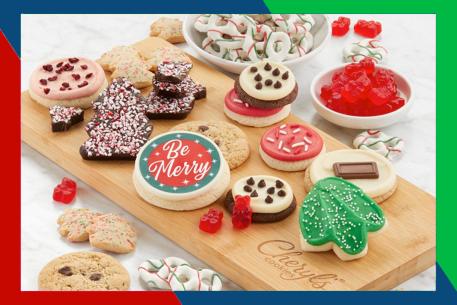 Cheryl's Cookies collection with candy and pretzels on a wooden board.