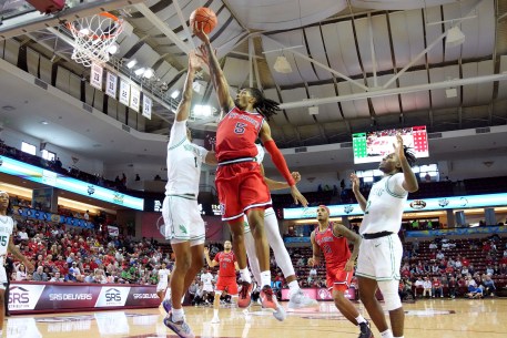 Daniss Jenkins, who scored 17 points but had five turnovers, goes up for a layup over Aaron Scott during St. John's 53-52 win over North Texas.