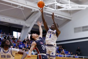 Kadary Richmond #1 of the Seton Hall Pirates attempts a shot as Brayden Reynolds #24 of the Fairleigh Dickinson Knights defends during the first half of a game at Walsh Gym