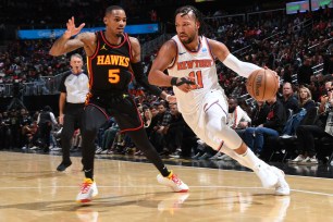 Jalen Brunson, who scored 24 points, drives to the basket during the Knicks' 116-114 victory over the Hawks.