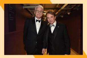 Steve Martin (L) and Martin Short pose for a backstage photo while wearing suits.
