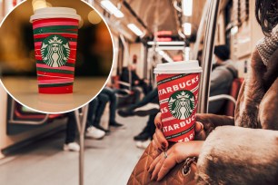 Budapest, Hungary â November 30, 2021: A closeup shot of a woman sitting in the metro train, holding a cup of Starbucks coffee